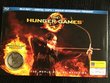 The Hunger Games  (LIMITED EDITION Blu-ray + Digital Copy PLUS BONUS Mockingjay Pendant)