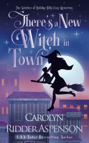 There's a New Witch in Town (The Witches of Holiday Hills Cozy Mystery Series)