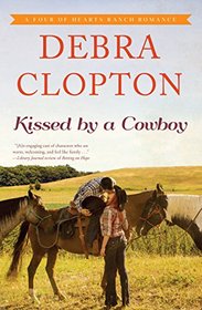 Kissed By a Cowboy (A Four of Hearts Ranch Romance)