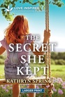The Secret She Kept