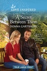 A Secret Between Them (Love Inspired, No 1570) (True Large Print)