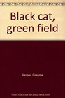 Black cat green field