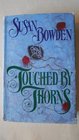 TOUCHED BY THORNS